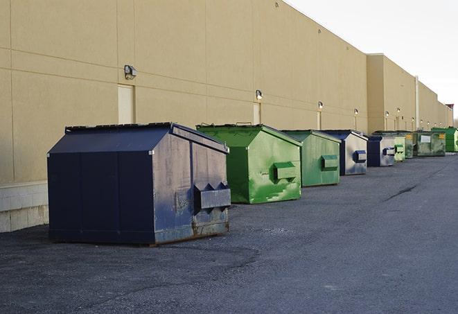 an empty dumpster ready for use at a construction site in Berkshire